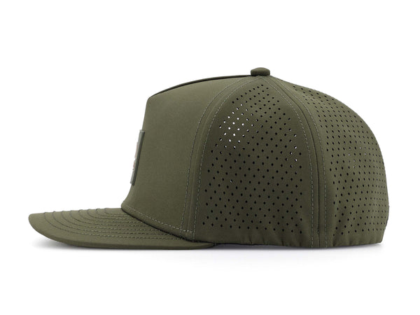 Hunter Green colored Rover premium performance fitted hat from Hatchet Headwear pictured with a white foreground and background. The hat is positioned at an approximately 90 degree angle to showcase the left-side profile of the hat. The diamond shaped laser perforations of the hat designed to provide breathability and reduce heat retention are prominently featured.