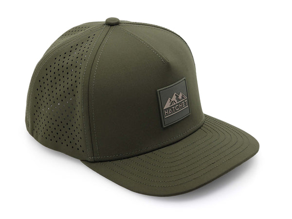 Hunter Green colored Rover premium performance fitted hat from Hatchet Headwear pictured with a white foreground and background. Hat features a color matched Hunter Green rubber logo patch with the Hatchet Headwear logo (mountains, tent, and hatchet above the word "HATCHET) in taupe. The hat is positioned at an approximately 45 degree angle to showcase the front and right-side profile of the hat. Image perspective of the hat is taken such that the hat is photographed from above.