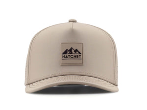 Boulder colored Rover premium performance fitted hat from Hatchet Headwear pictured with a white foreground and background.  Hat features a color matched Boulder rubber logo patch with the Hatchet Headwear logo (mountains, tent, and  hatchet above the word "HATCHET) in black.  The hat is pictured from the front and facing directly at the camera.