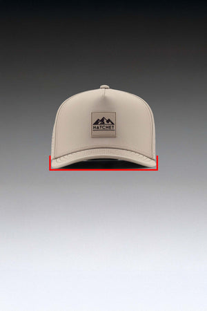 Boulder colored Rover premium performance fitted hat  positioned forward facing.  A straight red line is drawn from one side of the bill/brim to the other side of the bill/brim.  The straight red line is intended to depict how the width of the hat is measured.  The hat is sitting in front of a gray gradient background.