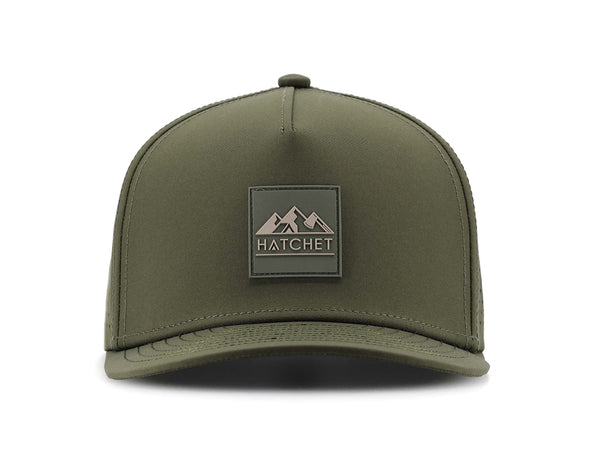 Hunter Green colored Rover premium performance fitted hat from Hatchet Headwear pictured with a white foreground and background.  Hat features a color matched Hunter Green rubber logo patch with the Hatchet Headwear logo (mountains, tent, and  hatchet above the word "HATCHET) in taupe.  The hat is pictured from the front and facing directly at the camera.