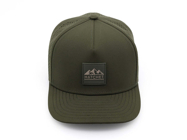 Hunter Green colored Rover premium performance fitted hat from Hatchet Headwear pictured with a white foreground and background.  Hat features a color matched Hunter Green rubber logo patch with the Hatchet Headwear logo (mountains, tent, and  hatchet above the word "HATCHET) in taupe.  The hat is pictured from the front and facing directly at the camera.  Camera position is elevated and front facing image of the hat is captured from above.