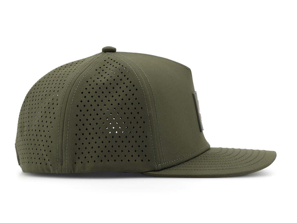 Hunter Green colored Rover premium performance fitted hat from Hatchet Headwear pictured with a white foreground and background.  The hat is positioned at an approximately 90 degree angle to showcase the right-side profile of the hat.  The diamond shaped laser perforations of the hat designed to provide breathability and reduce heat retention are prominently featured.