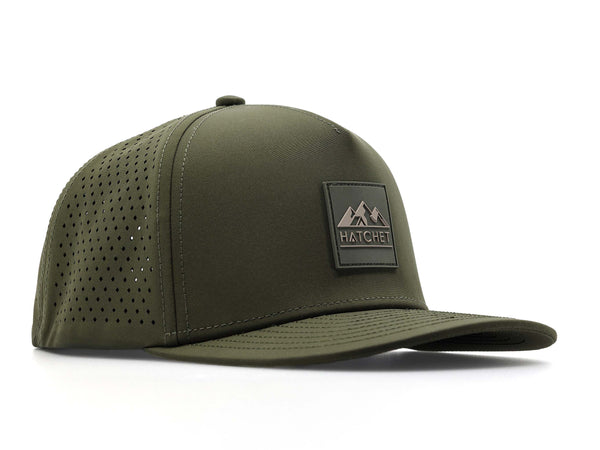 Hunter Green colored Rover premium performance fitted hat from Hatchet Headwear pictured with a white foreground and background.  Hat features a color matched Hunter Green rubber logo patch with the Hatchet Headwear logo (mountains, tent, and  hatchet above the word "HATCHET) in taupe.  The hat is positioned at an approximately 45 degree angle to showcase the front and right-side profile of the hat.  Image perspective of the hat is taken such that the hat is slightly above the camera lens position.